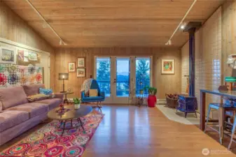 The sky is the limit for how you use this large flex space on main level. Accesses deck on the west side of the home.