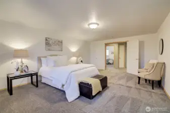 Large primary bedroom with double entry doors.