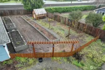 Greenhouse with power and garden beds.