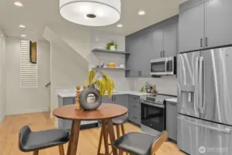 Chic pendant lighting and generous counter space elevate everyday meals into memorable moments.