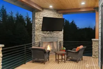 Stone fireplace, perfect location for taking in the beautiful mountain and territorial views!