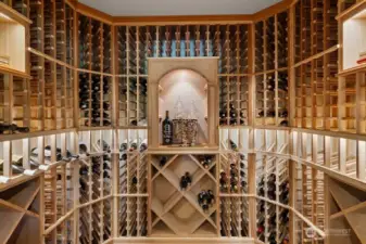 Gorgeous 894-bottle wine cellar with sleek glass entry door, offering both visual impact and ideal storage conditions. Whether you’re an avid collector or love entertaining, this impressive cellar is a statement piece designed to elevate the experience.