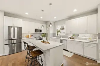 Center island with seating, perfect for casual meals or gathering with friends