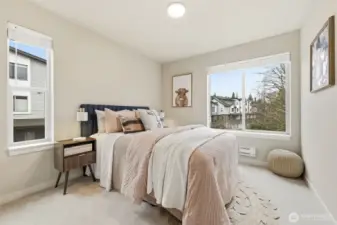 Third bedroom with bright windows and flexible space for work-from-home or hobbies