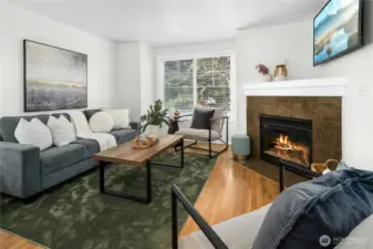 Bright and airy living area with large windows bringing in natural light throughout the day.