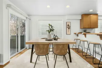 Dining area with direct access to private deck — ideal for morning coffee or evening gatherings.