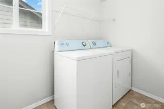 Convenient upstairs laundry room adds everyday ease and efficiency.
