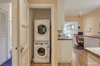 Cleverly designed stacked washer and dryer located between the bedrooms and kitchen.