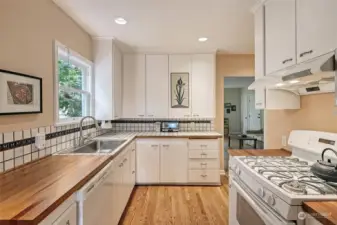 Fully renovated kitchen with mango wood countertops and new appliances.