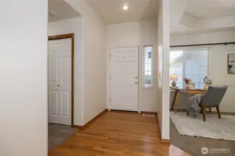 Entrance with oak flooring, hallway to bedrooms to left, den/office to right.