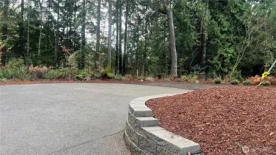 Private lot surrounded by trees and peek-a-boo view of the inlet-water to Lake Tapps