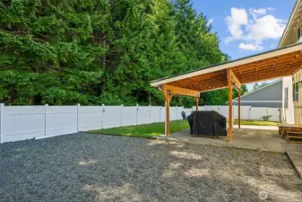 Side view of your large backyard and look at those trees!