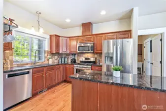 Kitchen with stainless appliances, granite counters and new stainless sink.