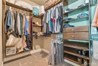 Primary walk-in closet with upgraded shelving
