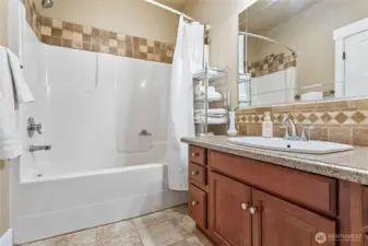 Primary bathroom with separate toilet area