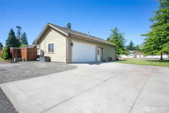 Two car garage and large driveway with extra parking