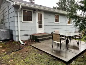 Back patio is large enough for a table and chair set. Heat Pump located adjacent to back porch.
