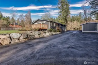 Circular driveway recently graveled and rolled.