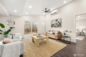 Behind the picture on the wall is an outlet for a mounted TV