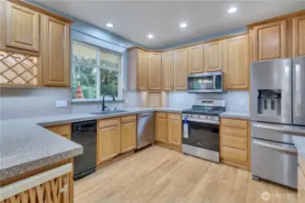 Built in breadbox in the far corner. Some outlets have built in USB plugs. Appliance to the left is the compactor and the one in the corner is the dishwasher.