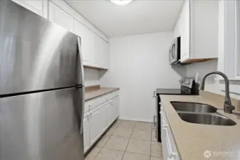 Kitchen has stainless steel appliances
