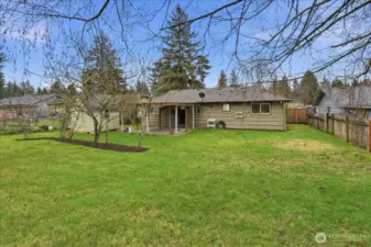 Yard is fully fenced which is perfect for pets.