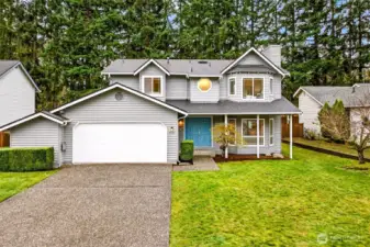 Set against a backdrop of towering Pacific Northwest evergreens, this well-proportioned two-story home offers a commanding street presence, a generous front lawn, and a two-car garage — all in one of Redmond's most desirable English Hill addresses.