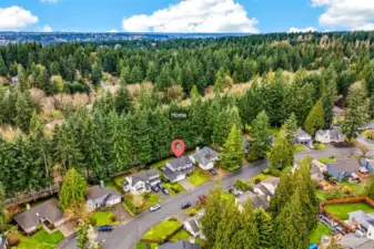 Nestled within one of Redmond's most established neighborhoods, this English Hill home sits surrounded by towering Pacific Northwest forest, a quiet cul-de-sac setting, and easy access to the Microsoft, Google, and Meta campuses — the ideal combination of natural beauty, community, and convenience in the heart of the Eastside.