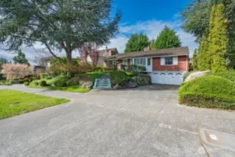 Looking southwest. Just a few steps up to the front. Generous parking space.