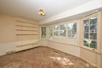 Large front Bedroom #1 or Den with a wall of windows to enjoy the morning sunshine.