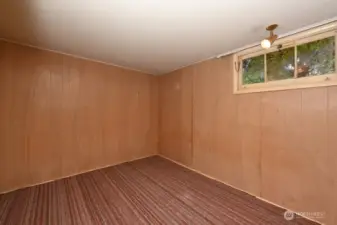 Bedroom #4 in NE corner of lower level. Now non-conforming.