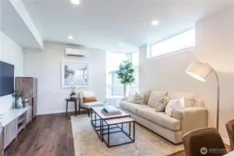 Large living room has ample space for a sectional, chairs, and entertainment center.  This picture does not do that space justice!