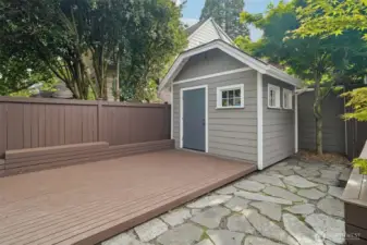 Concrete parking pad is under this deck. Easy to convert to off-street parking
