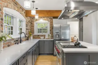Wolf range, commercial hood, updated counters and cabinets, new hardwoods