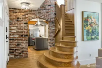 An elegant blend of exposed brick, wood and original millwork