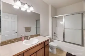 The downstairs full bathroom which sits between the front bedroom and the den/office.