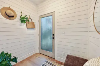 Mudroom leads to the private parking space for this home.