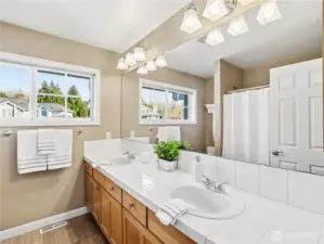 This expansive dual vanity offers plenty of room for peaceful morning routines