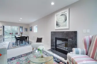 Cozy living room with gas fireplace. Great cross-breeze from the two decks.