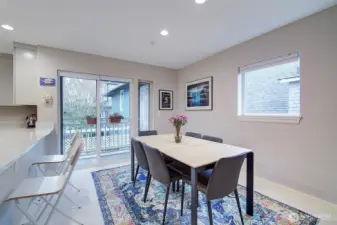 Unusually large dining area with slider to back deck and storage.