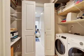 Side by side washer/dryer and tons of storage.