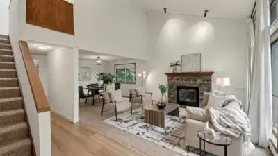 A welcoming layout with soaring ceilings, cozy living spaces, and seamless flow into the dining area—perfect for both everyday living and entertaining.