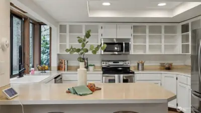This well-appointed kitchen offers abundant cabinetry and a layout designed for easy meal prep and entertaining.