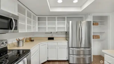 A spacious layout with abundant storage options, including open shelving for easy access and display.