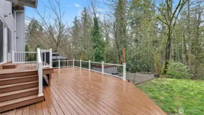 Enjoy expansive outdoor living with a deck that flows effortlessly into the surrounding yard.
