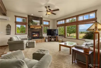 The living space has wonderful mountain views to take in the sunrise! Warm propane fireplace with rocked surround & live edge mantle.