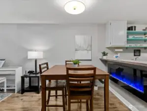 Dining area - electric fireplace stays with  home.