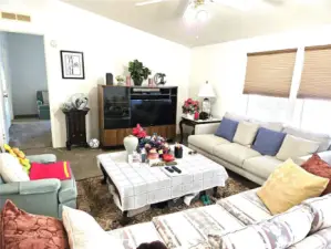 Living room leads to primary bedroom.