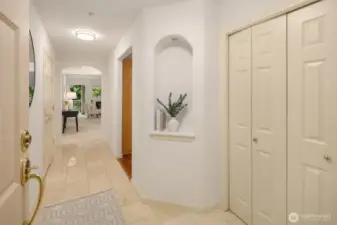 Foyer to unit with travertine