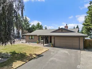 Two car garage with rv parking to the right